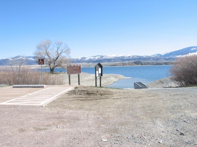 picture showing This picture shows marked accessible parking located next to the boat ramp. The boat ramp is steep.  Depending on water levels, it may or may not be accessible.